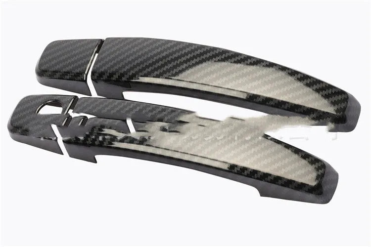 Carbon fibre pattern door handle cover for Opel Vauxhall Astra H and J car interior.
