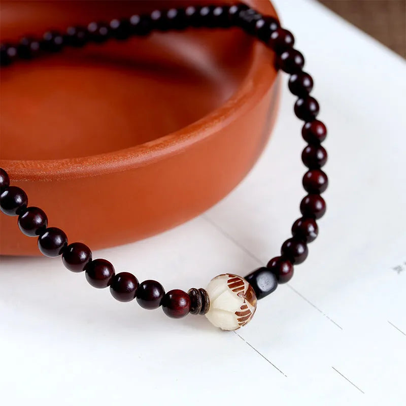 Natural rosewood bracelet with knitted texture and 10mm floral centrepiece in unisex retro design