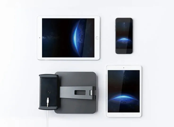 Silver folding aluminium phone and tablet stand with 360-degree rotation on desktop