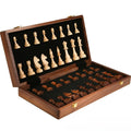 Walnut foldable solid wood children's chess set with brown board and pieces on wooden surface
