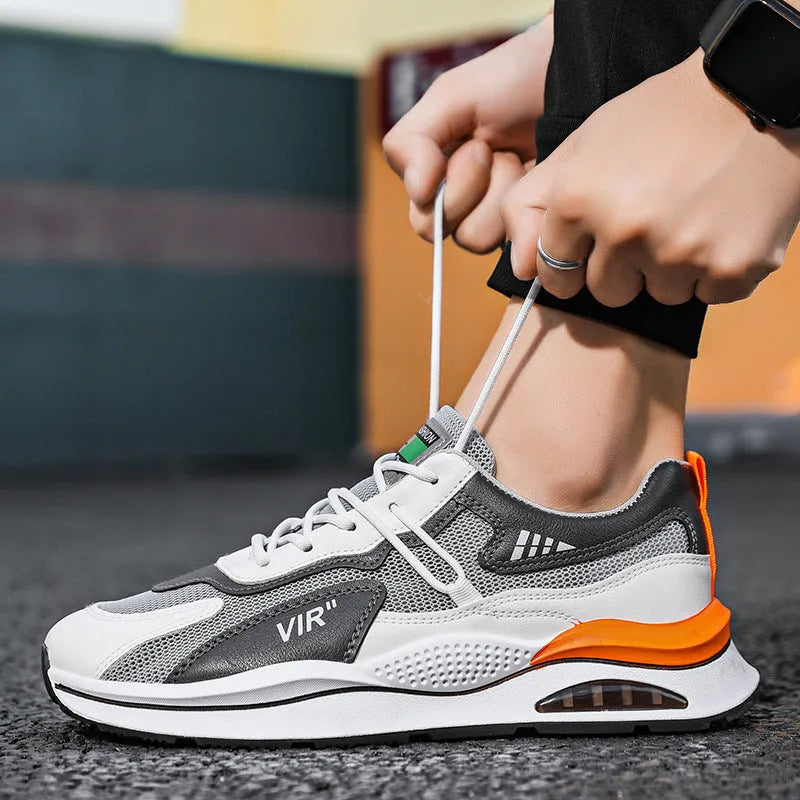 Men's grey and black mesh casual running shoes with a lightning graphic and round toe.