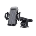 Black universal car phone holder mounted on a car dashboard holding a mobile phone