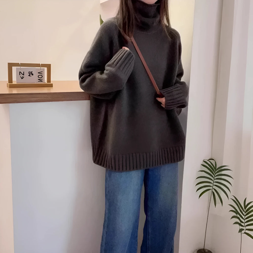 Women's loose turtleneck sweater with a thick curling pile collar in a solid colour