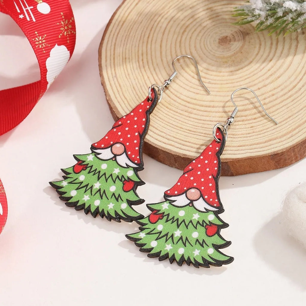 Wooden Christmas earrings with geometric shapes featuring printed Christmas tree and snowman Santa Claus designs