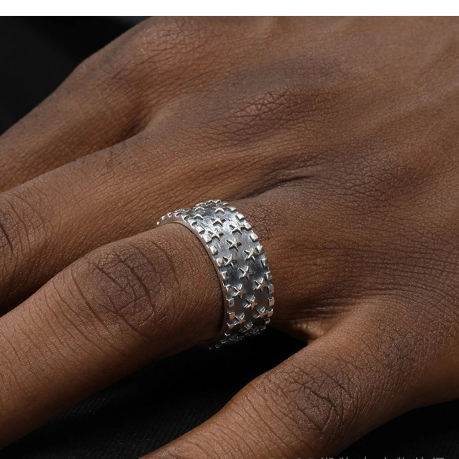 Adjustable sterling silver ring with geometric five-pointed star pattern