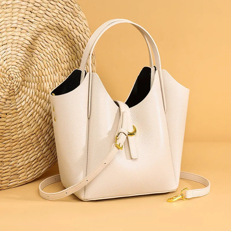 Genuine leather women's hand holding bucket bag in retro style with file bag interior