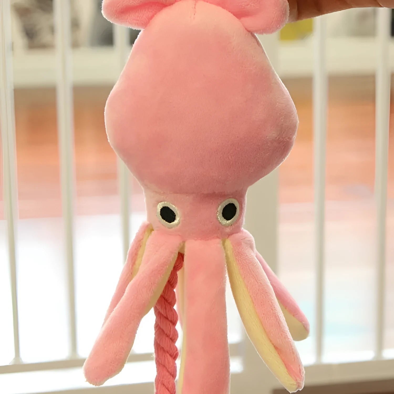 Pink octopus pet plush rope toy for dogs with tentacle design and rope construction