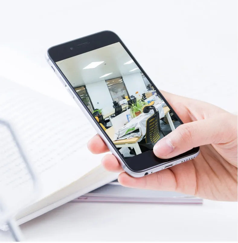 Indoor 360 degree wifi security camera with ABS housing showing rotation capability