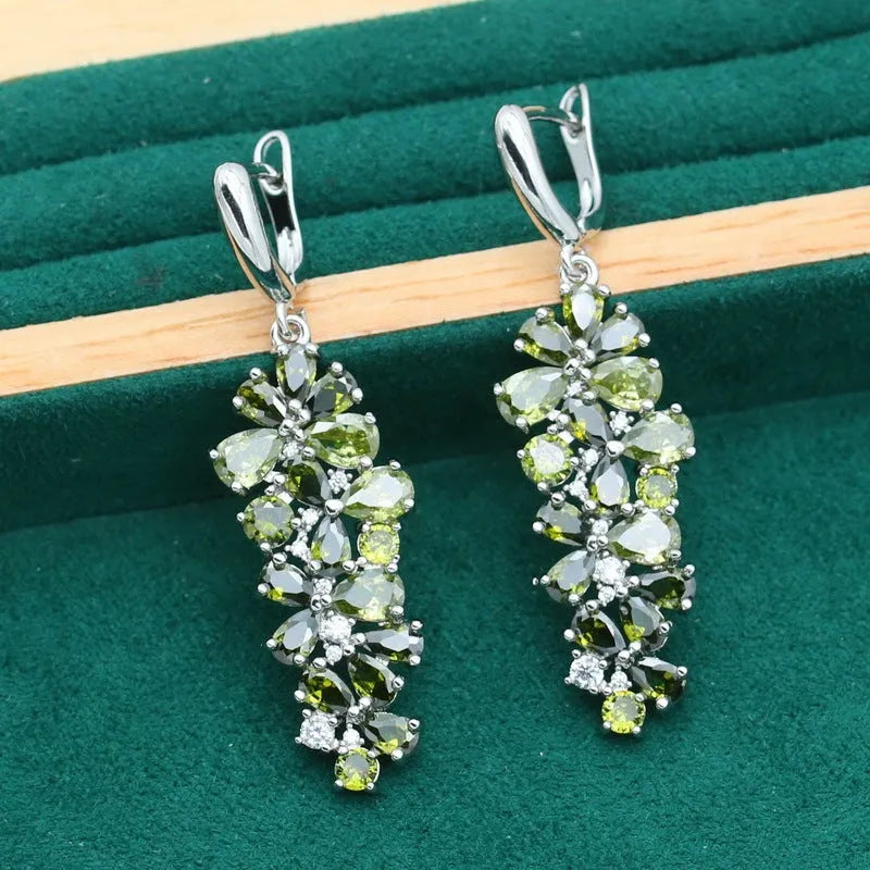 Retro jewellery set with plant pattern designs showing necklace, bracelet, earrings and ring pieces