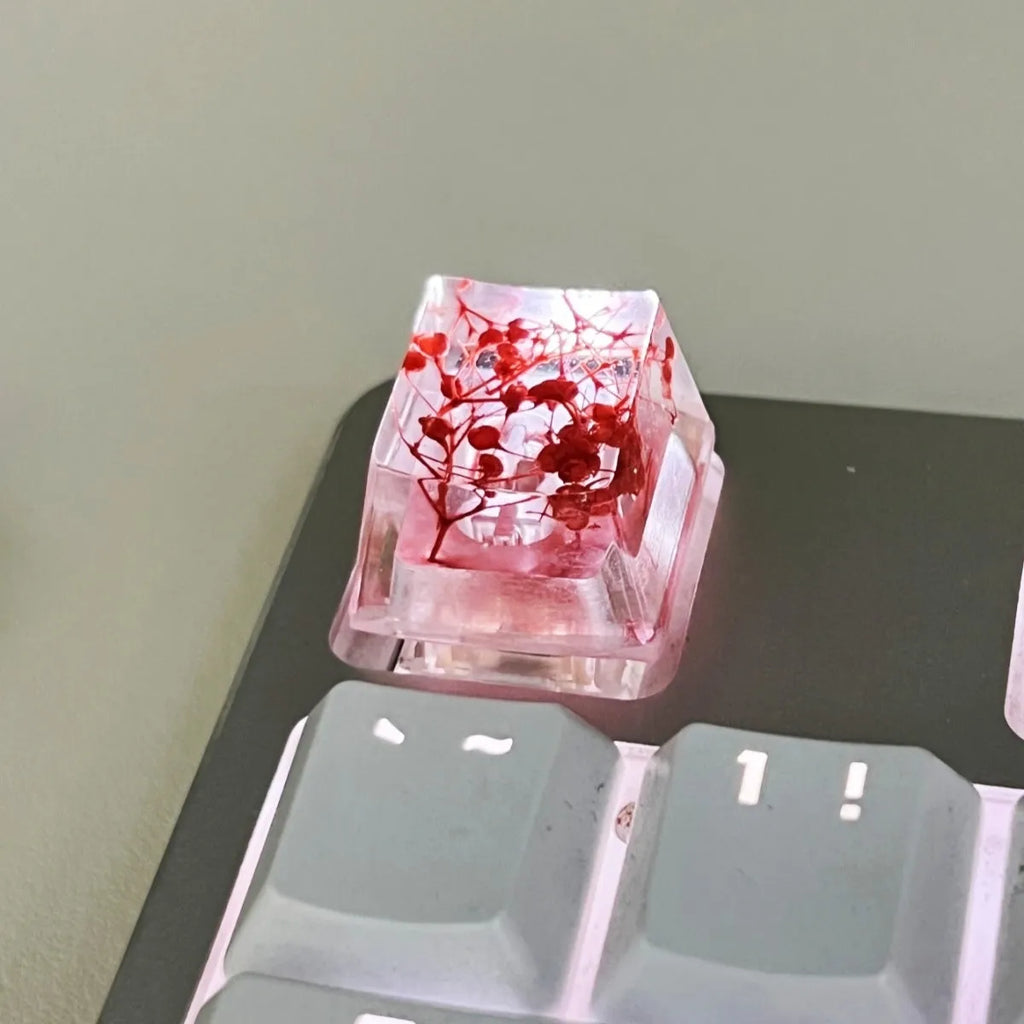 Transparent resin starry sky keycap for mechanical keyboards in green, measuring 1.8cm by 1.2cm.