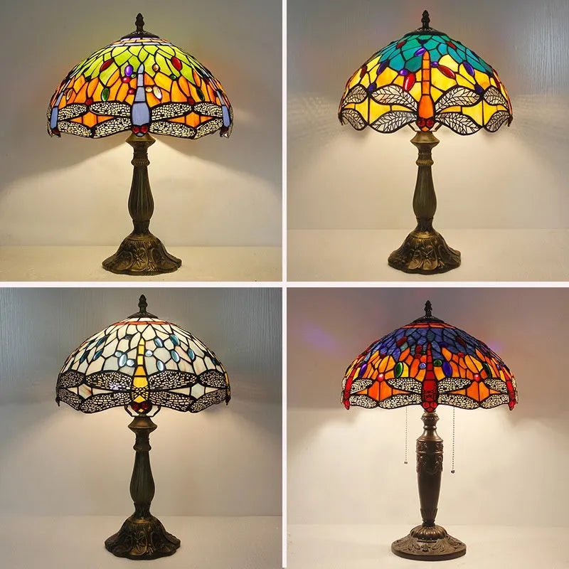 Tiffany style stone table lamp with blue dragonfly design on a bedside table.