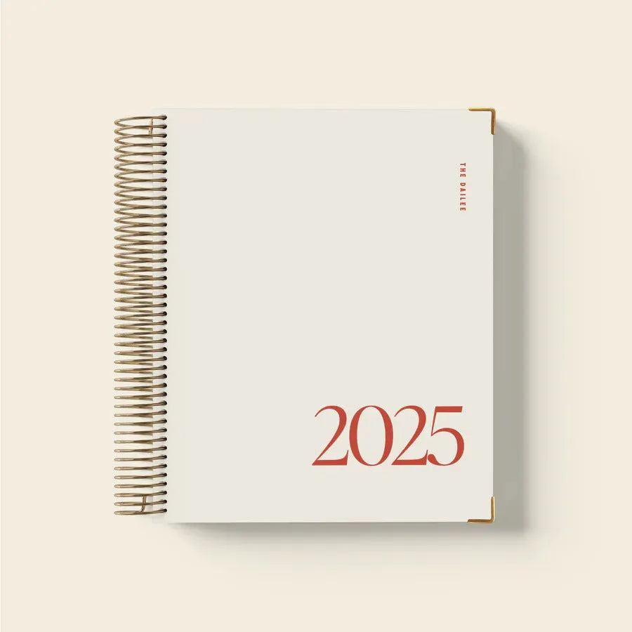 Cherry Red daily schedule coil notebook with spiral binding open to show interior pages
