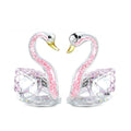 Modern white crystal swan decoration on a desk, available in red, blue, pink, and purple.