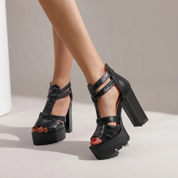 Women's black platform high heel sandals with a back zip and round toe on a rubber sole.