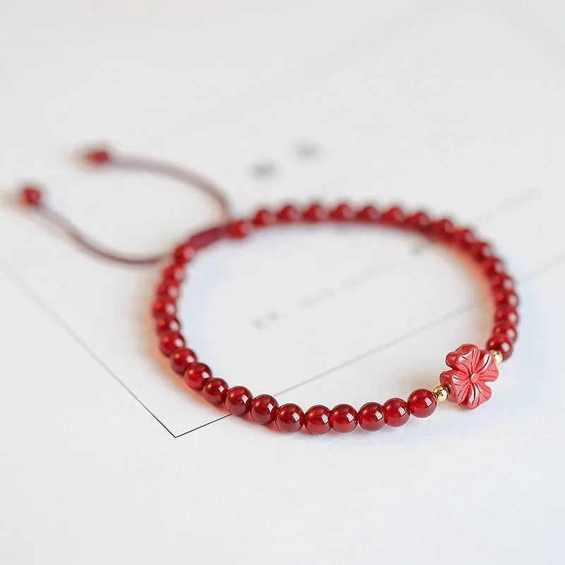 Hand-woven red agate bracelet with diamond beads in ethnic woven pattern