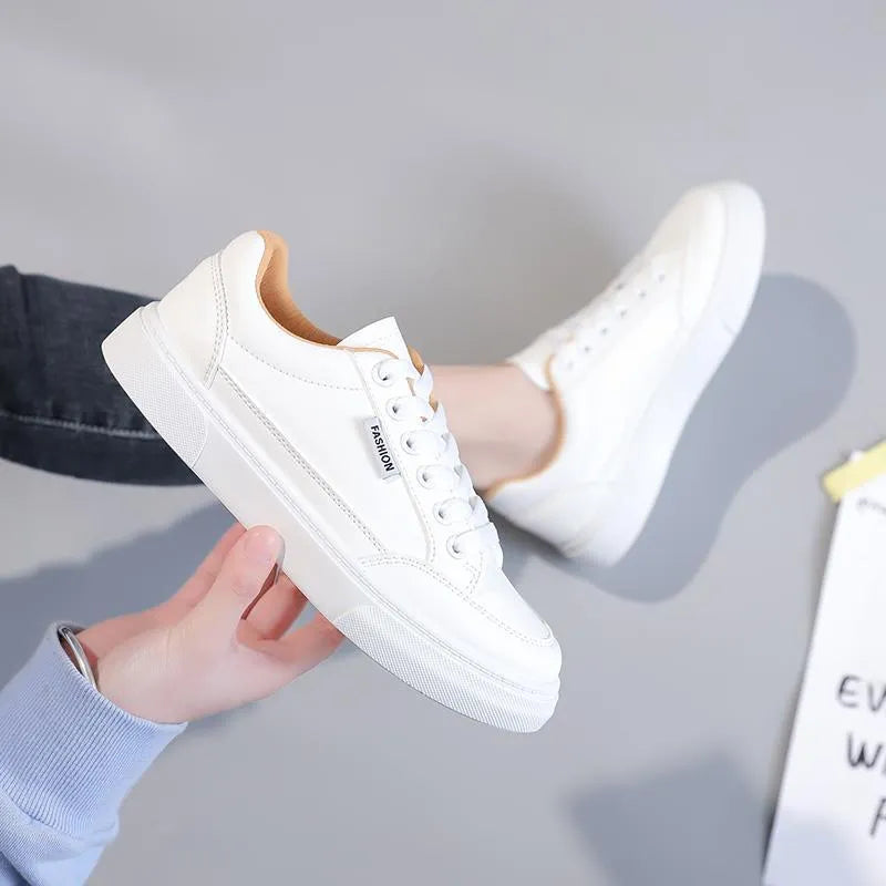 Korean style low-top sneakers in brown and white colours with artificial PU leather uppers