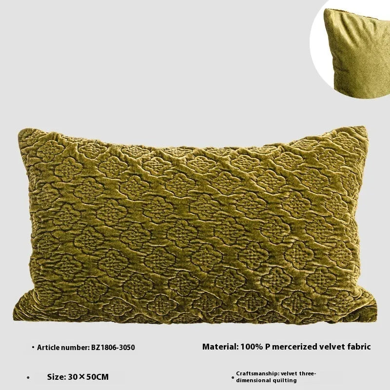 Brown gold antique-style quilted square cushion pillow and matching lumbar pillow on a sofa.