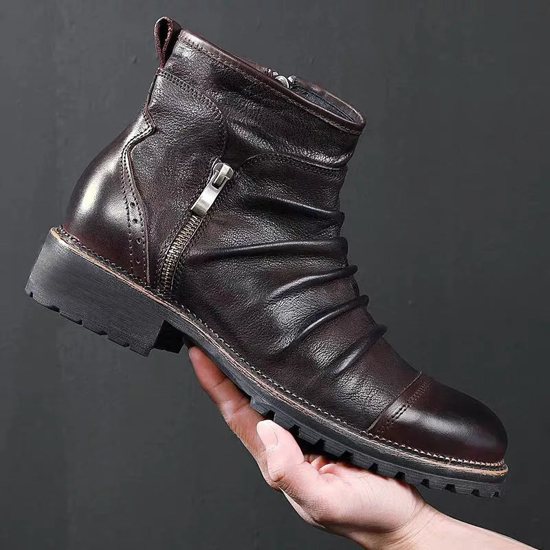 Men's black side zip cowboy boots with a round toe and mid-height horseshoe heel on a white background.