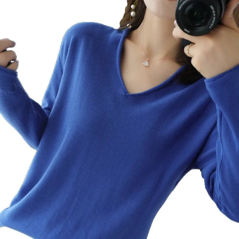 Women's V-neck long sleeve knit pullover top in a macaron colour on a hanger.