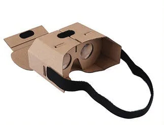 Corrugated paper virtual reality glasses headset for smartphones on a table.