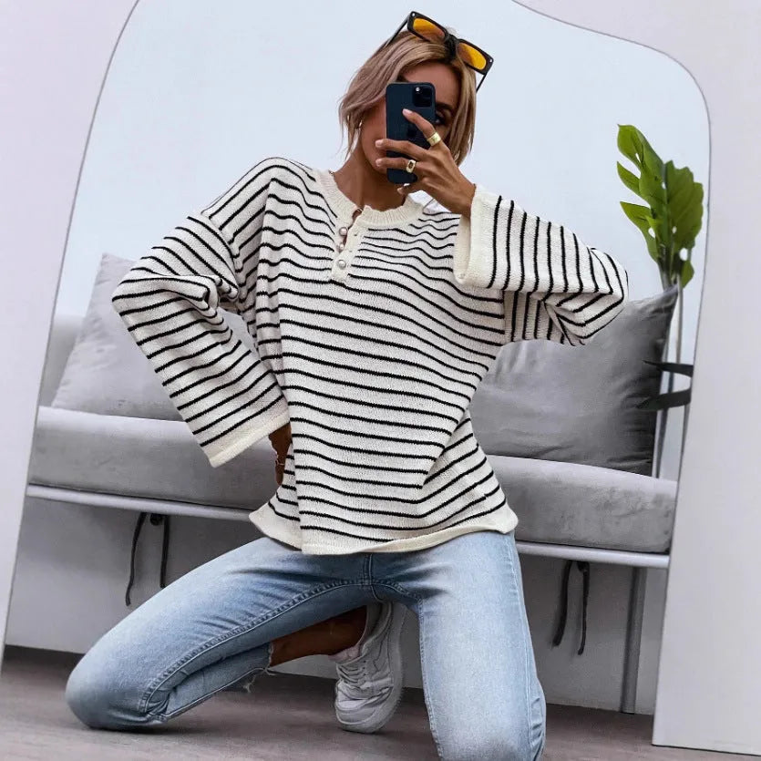 Women's black striped loose top with drop shoulders and button accents