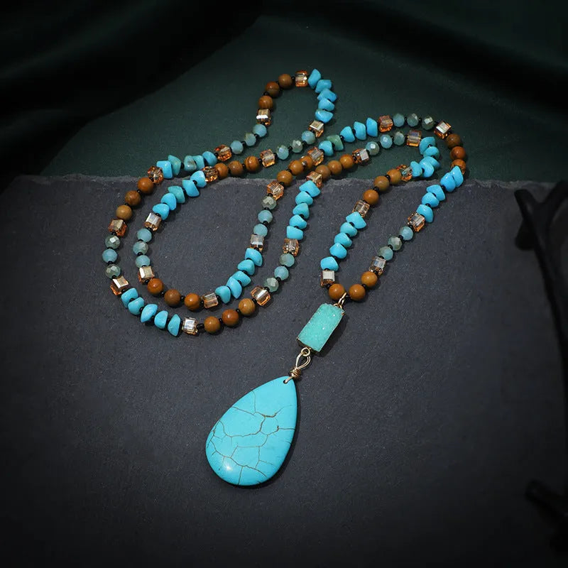Turquoise blue water drop shaped pendant necklace with ball bead chain and geometric design elements