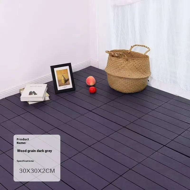 Plastic floor tile with wood grain pattern, showing non-slip surface, 300mm square dimensions.