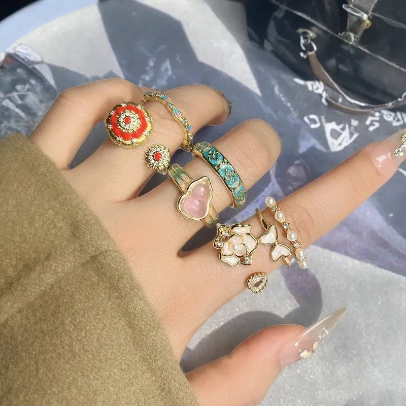 Women's adjustable copper ring with gourd design, flower and bow motifs, and inlaid zircon stones in a vintage oil dripping finish.