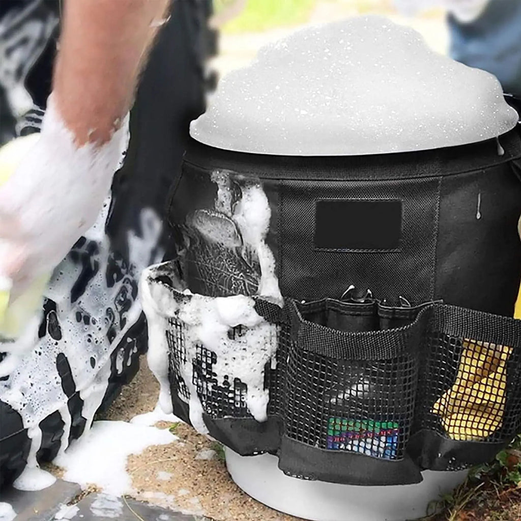 Black cylindrical polyester storage bag mounted on 5 gallon barrel with carry handles visible