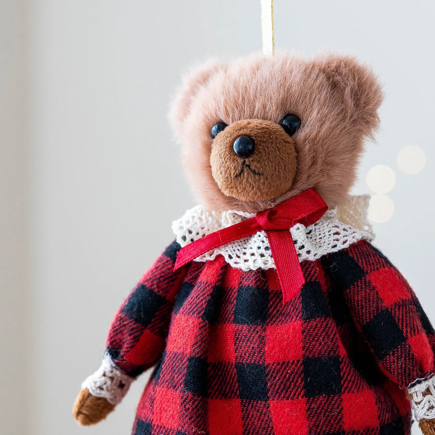 Cartoon plush bear couple, one in a gentleman's suit and one in a princess's plaid dress
