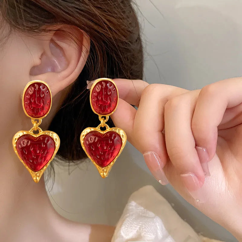 Silver needle pleated oval love heart alloy stud earrings in purple, red, green, and yellow and white colours.