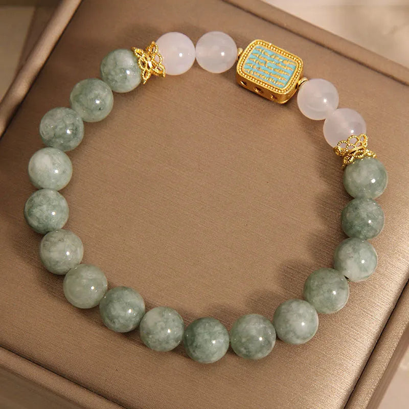 Women's oil green emerald crystal bracelet with five scriptural charms on wrist