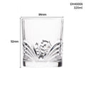 Clear thick-bottomed whiskey shot glass on a table showing 40ml capacity and solid base.