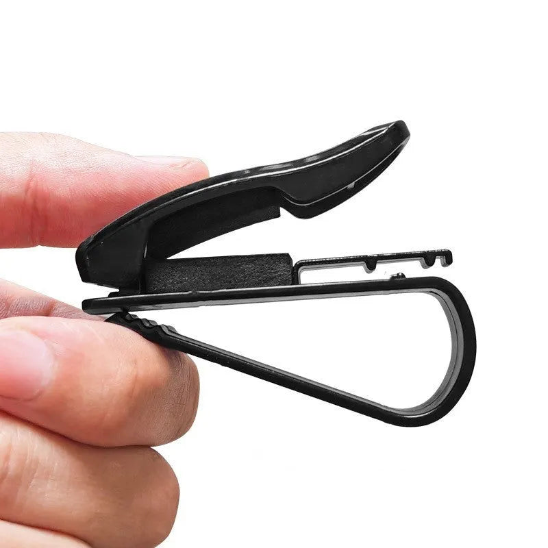 Black plastic car sun visor clip for holding glasses and cards, shown next to a ruler showing 6.5 cm length.