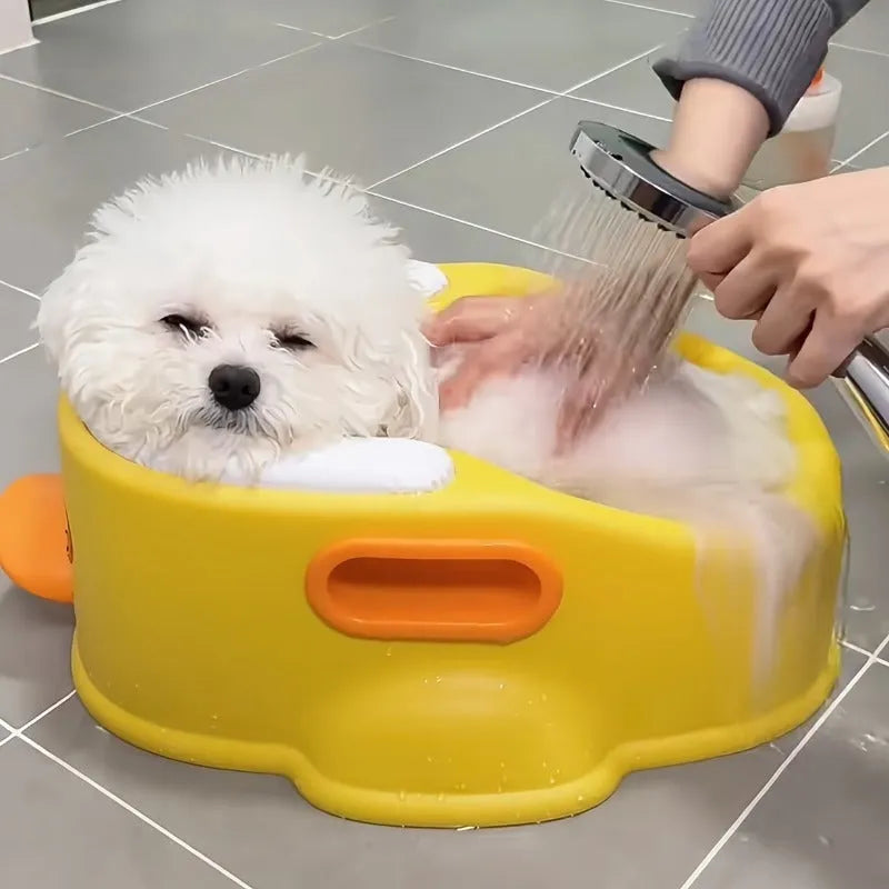 Blue PVC duck-shaped bathtub for washing a small dog or cat.