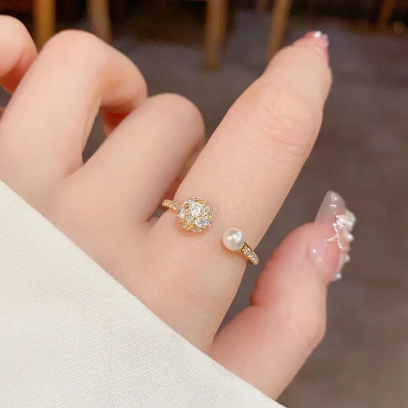 Geometric open-end ring with round zircon accents in gold or silver finish