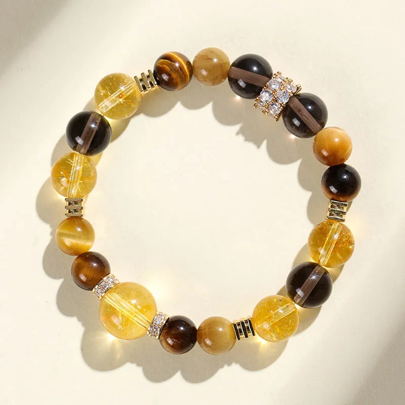 Close-up of a natural yellow artificial crystal string bead bracelet with 10mm tower-shaped beads.