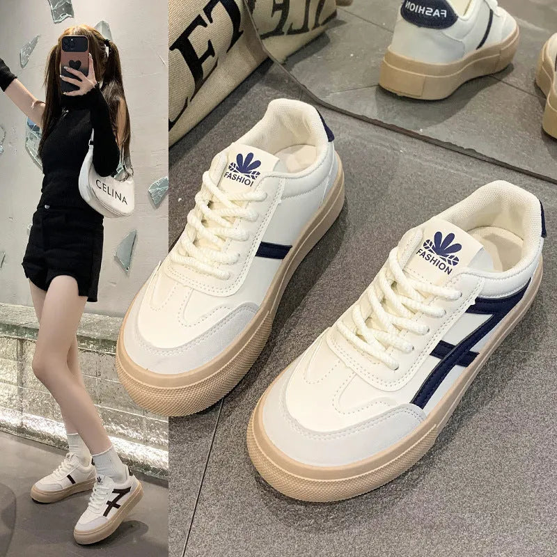 Brown and blue low-top lace-up casual shoes with a patent leather finish and round toe.