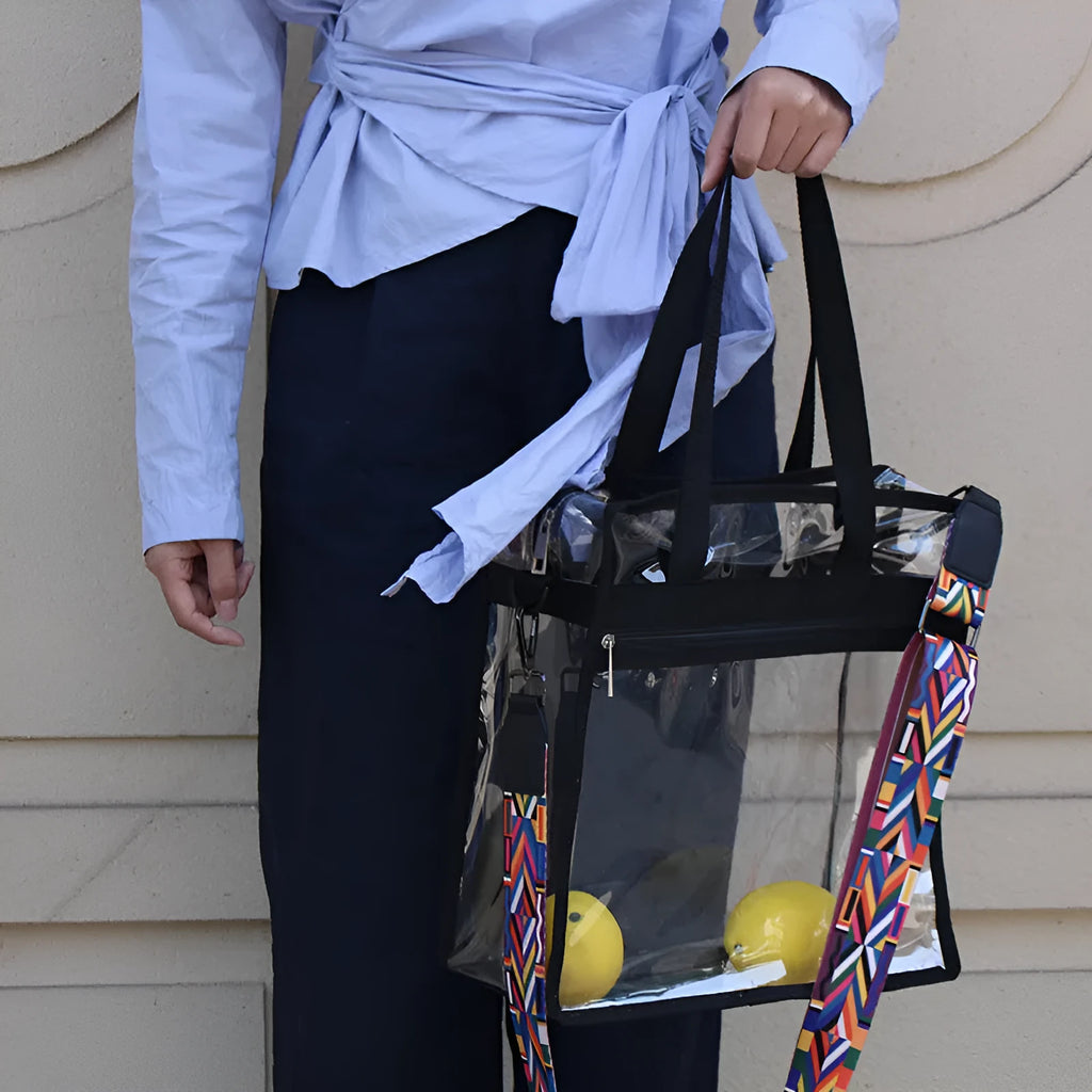 Women's transparent PVC front crossbody messenger bag with black side net pocket and double shoulder straps.