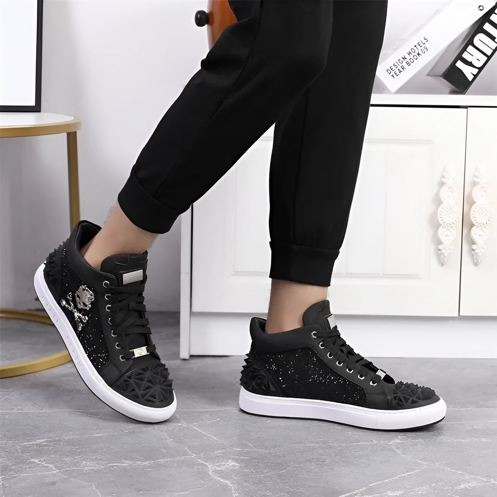 Men's black high top shoes with a skeleton design detail on the leather upper.