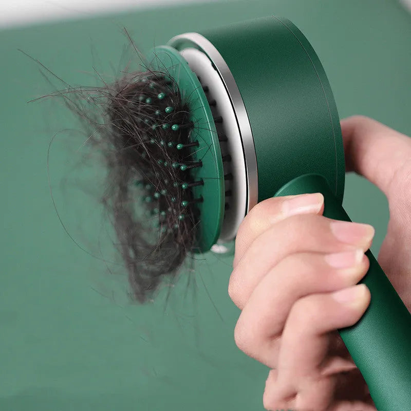 Plastic air cushion comb with long handle in white, green, and pink colours for hair detangling and styling