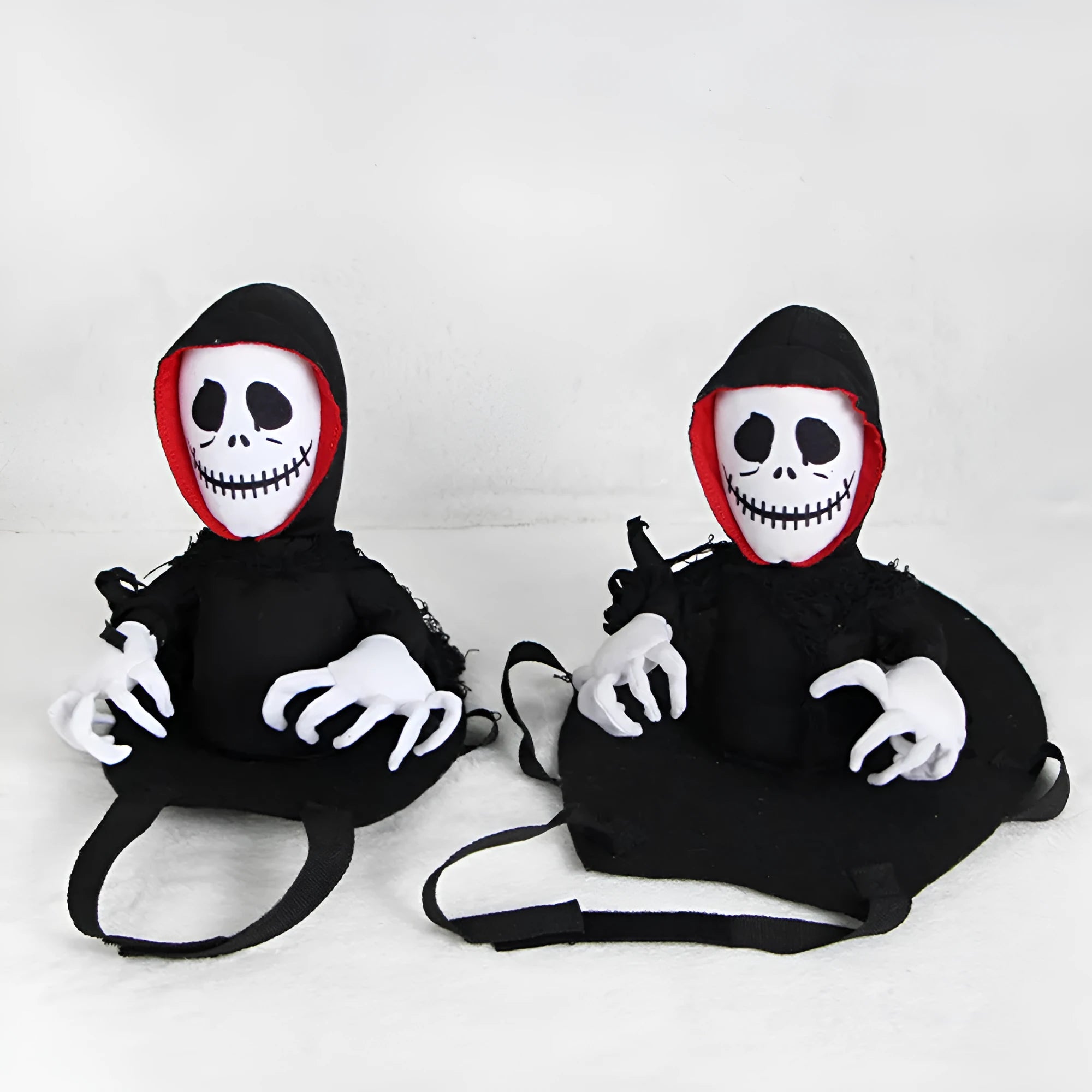Black polyester Halloween teddy cape for cats and small dogs, shown flat on a surface