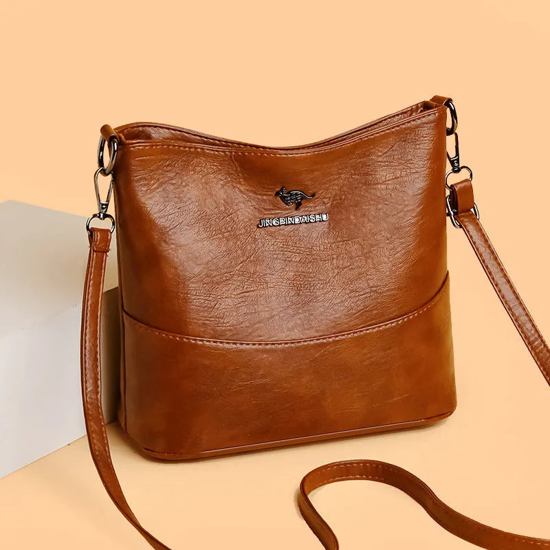 Women's soft leather shoulder bucket bag in black, wine red, or ginger yellow with mobile phone pocket