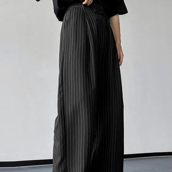 Black men's casual trousers with vertical stripes, front pleats, and an elasticated waistband.