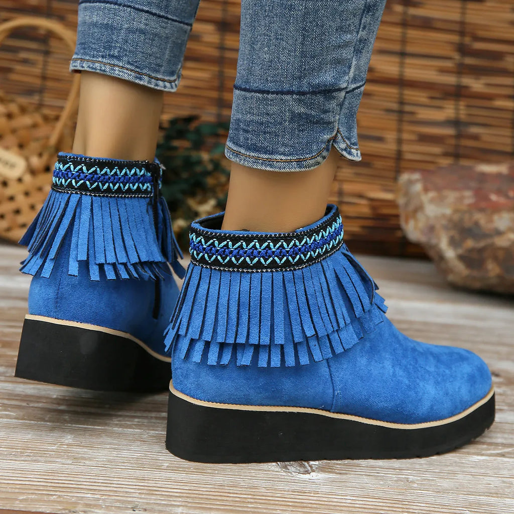 Women's dark brown suede wedge ankle boots with side zip and decorative tassel.