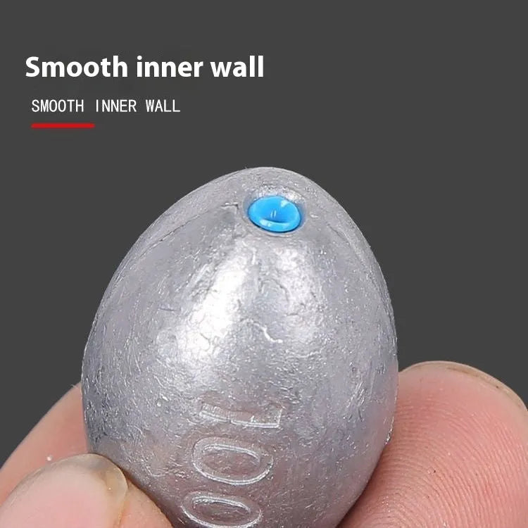 Tongxin rugby-shaped olive fishing pendant sinker with scale and plastic core in various weights.