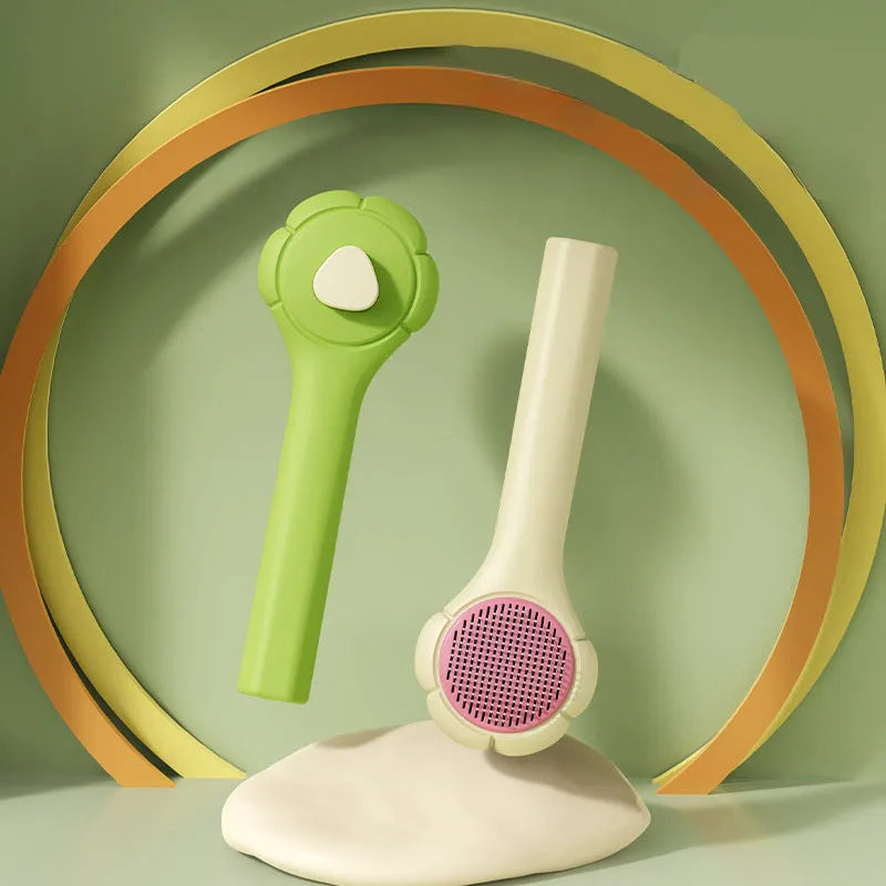 Floating needle comb for cats and dogs in green colour with ABS handle and steel teeth