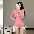 Women's long sleeve one-piece swimsuit in pink or black polyester fabric