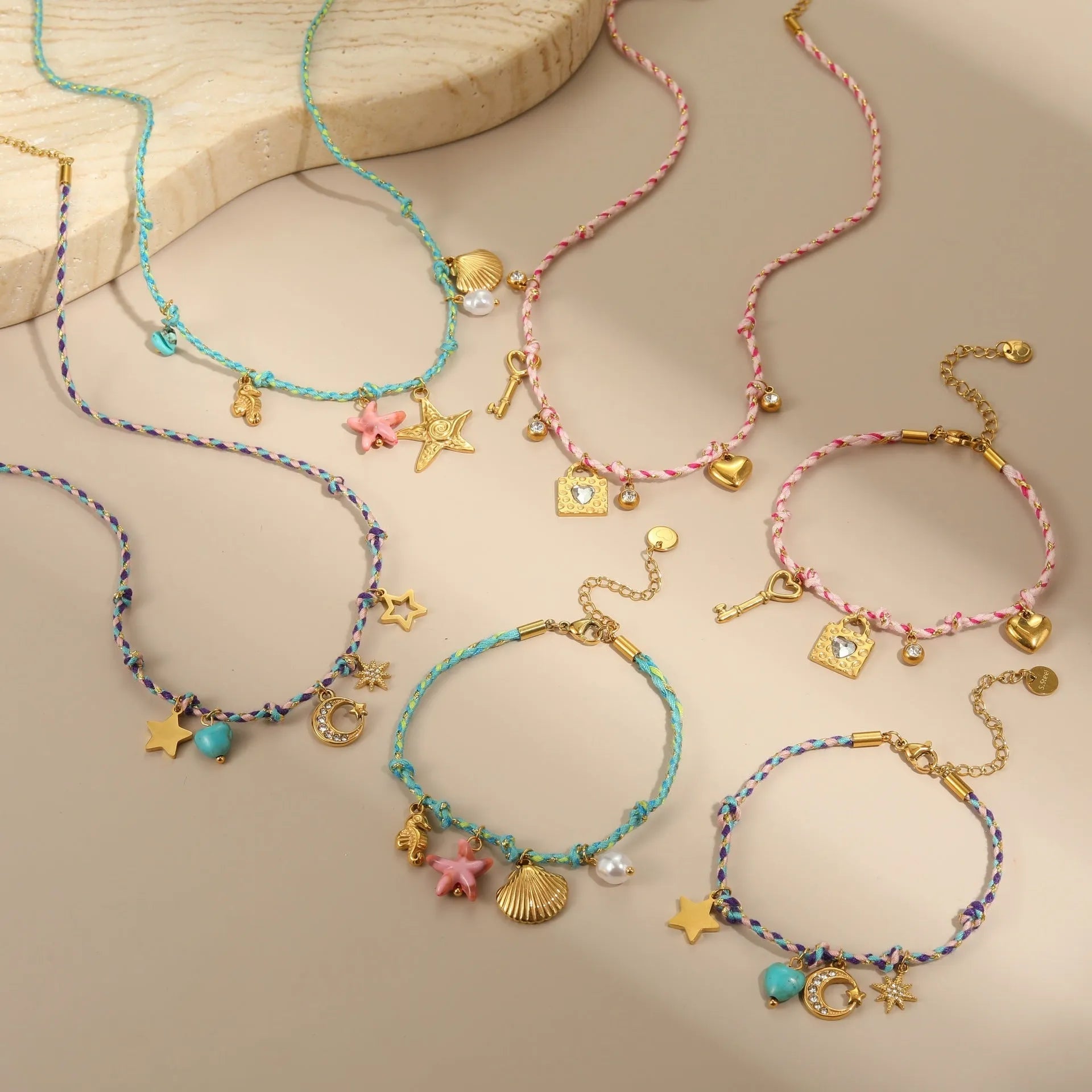 Braided rope chain stainless steel necklace with heart pendant and 18K gold plating on a model.