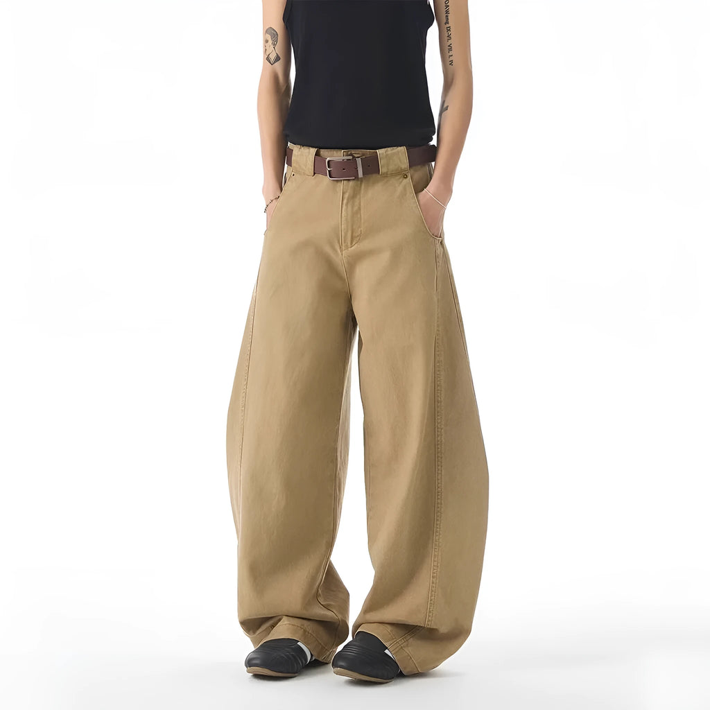 Brown loose-fit straight-leg men's jeans with a button fly and mid-rise waist.